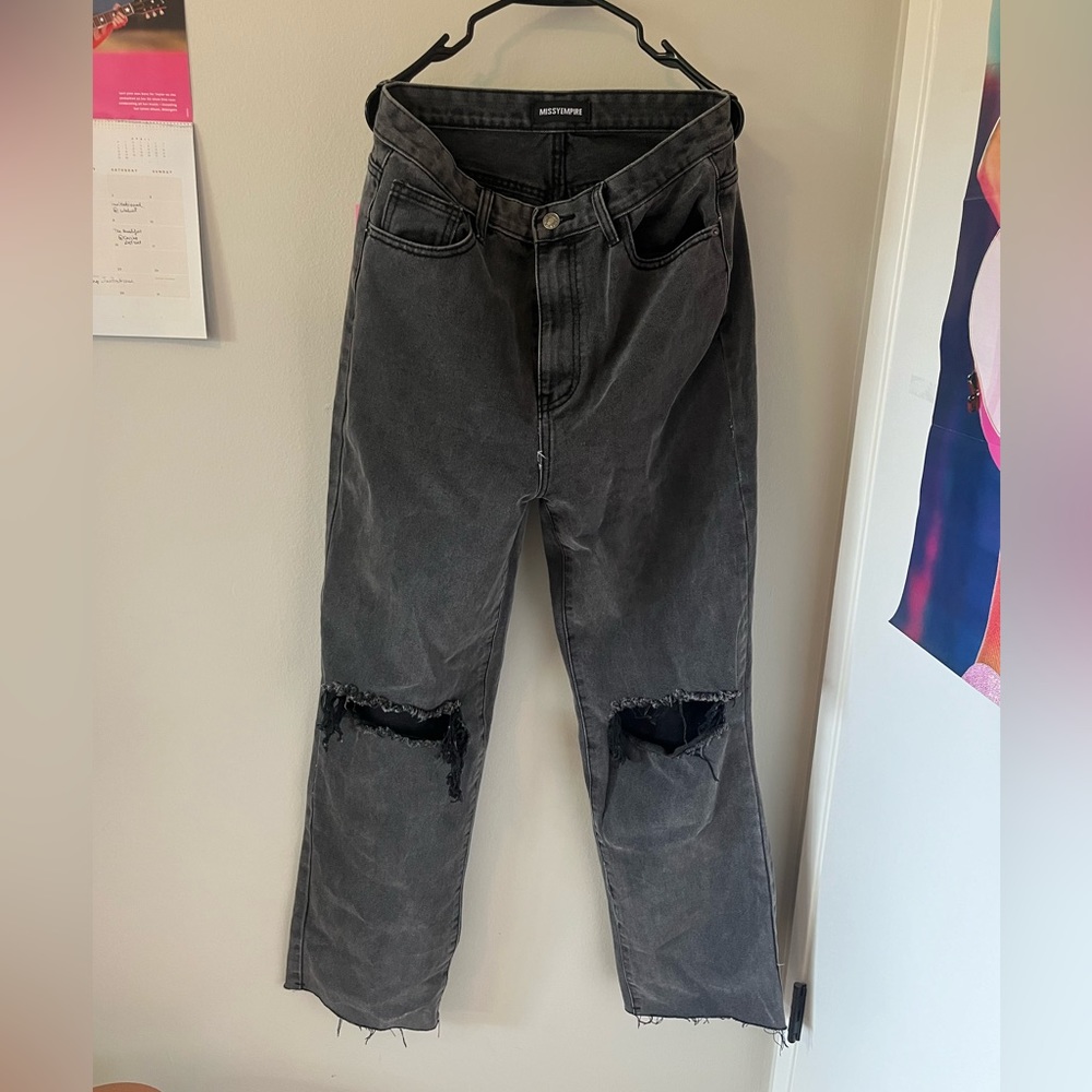 Black jeans with ripped knees